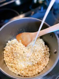 Adding milk to corn